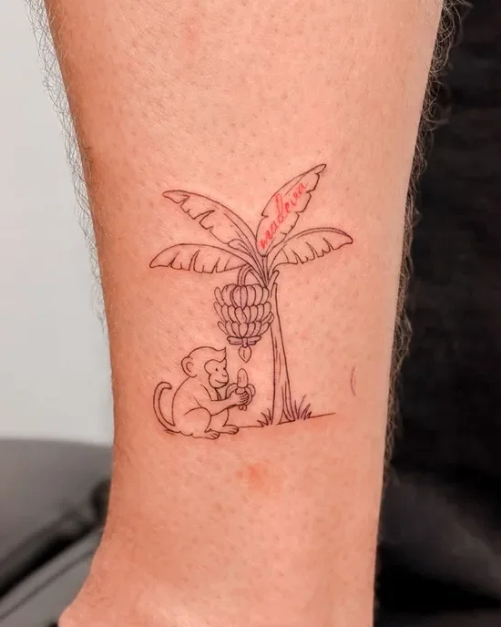 Memória da Madeira banana tree and monkey tattoo on the arm