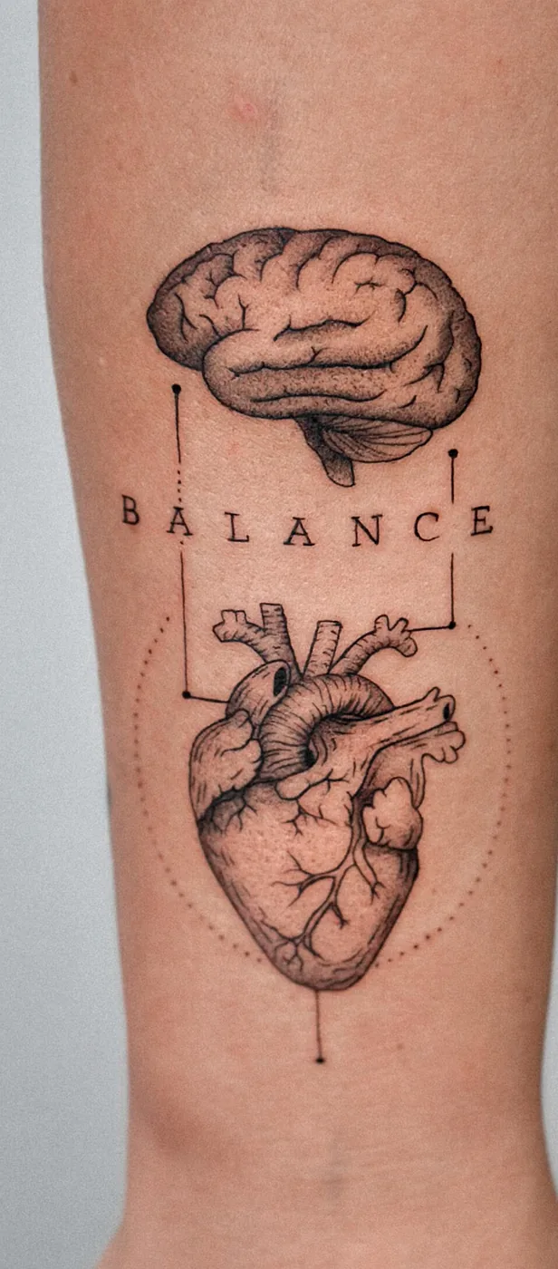 Brain and heart balance tattoo by Hugo Gonzalez