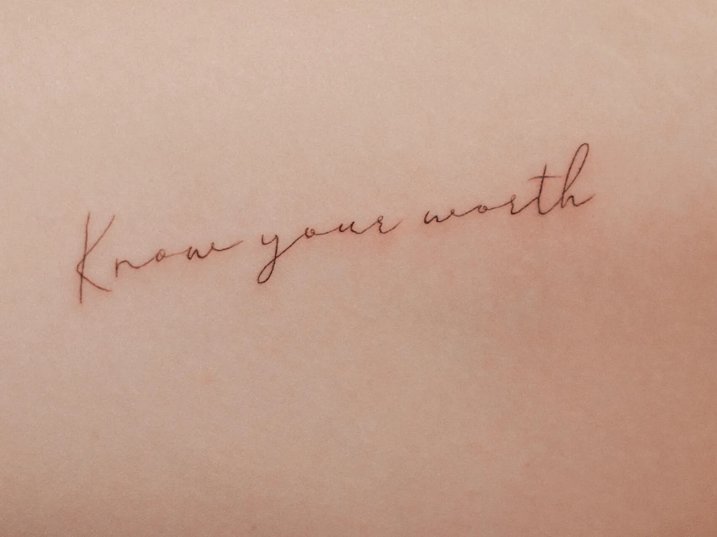 Fine line script tattoo by Hugo Gonzalez