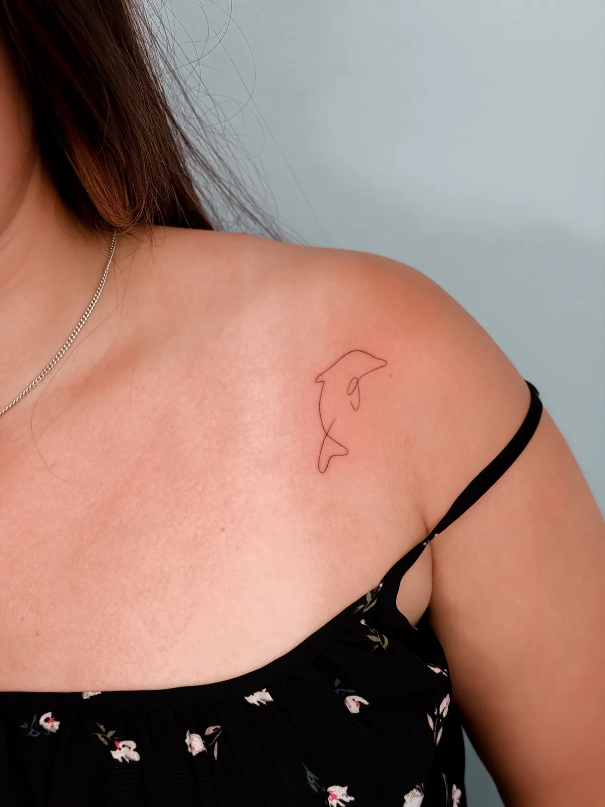 Fine line single line dolphin tattoo by Hugo Gonzalez, Madeira