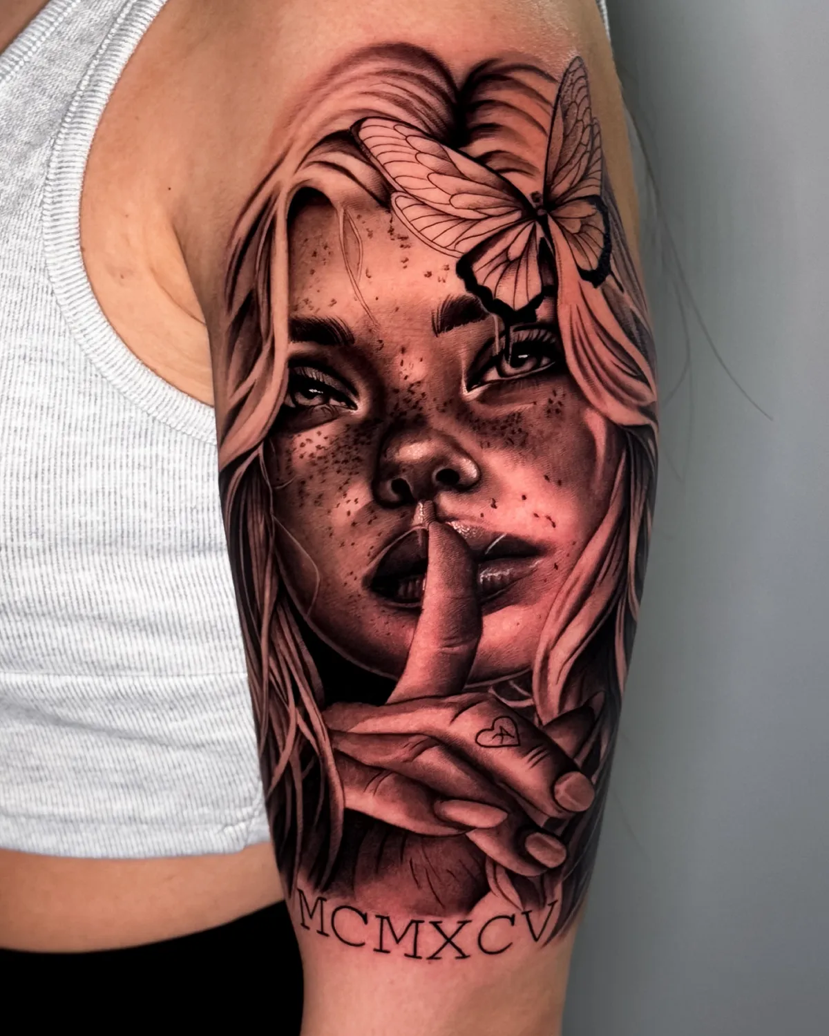 Black and grey portrait of a woman with butterfly by Hugo Gonzalez, Madeira